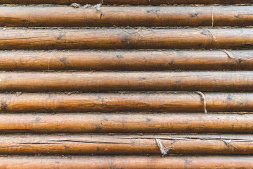 Old wall of logs. Cose up background.