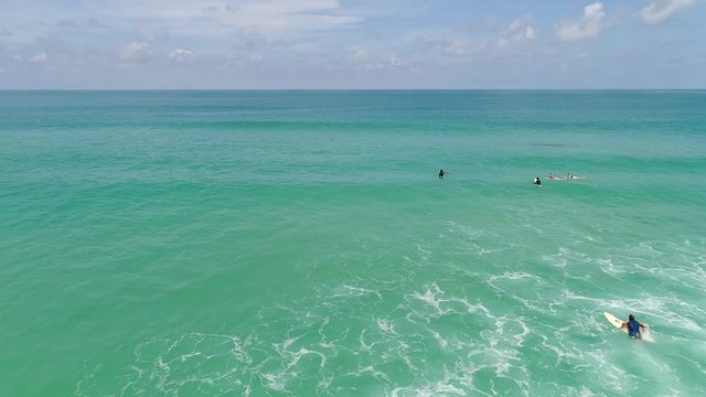 Aerial of surfing on the Andaman sea 
