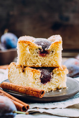 Homemade pie with plums on the table, copy space