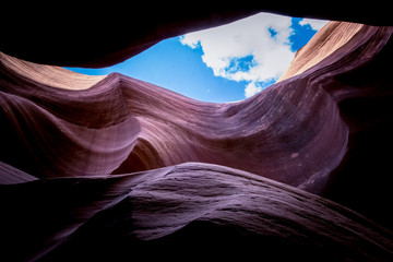 Erosion of sandstone rocks and blue sky. Lower Antelope Canyon, Arizona, USA