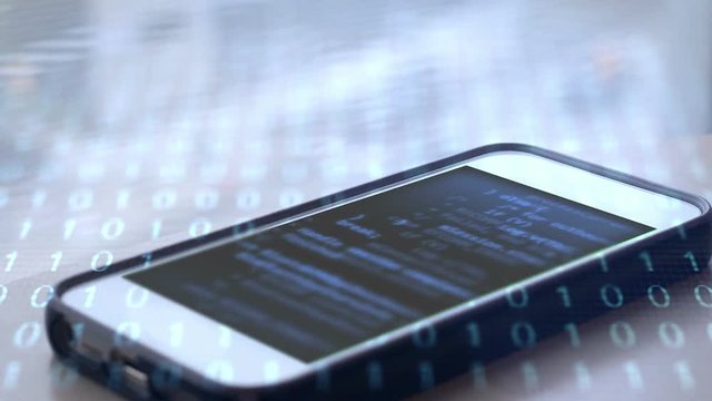 Smartphone with futuristic binary code overlay and scrolling script  - technology concept