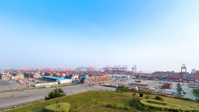 time lapse of shanghai container terminal with blue sky, modern busy harbor, China
