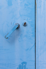 Blue door with lock and door handle.