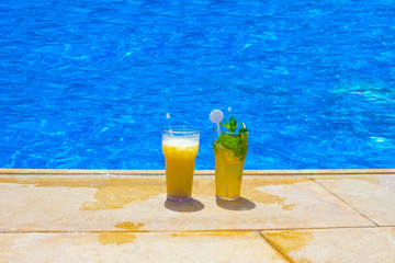 Fruit cocktail glasses at pool