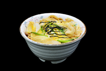 Japanese tradition food. katsu donis  a fried pork with egg and onion in a rice in bowl with black isolated background