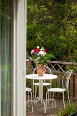 View to the Garden terrace with furniture and flowers