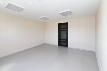 Interior empty office light room with white wallpaper unfurnished in a new building