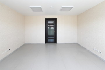 Interior empty office light room with white wallpaper unfurnished in a new building