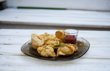 Deep-fried manti. Deep-fried pies. Pies with meat and ketchup. High-calorie food. Snack.   Carbohydrate food