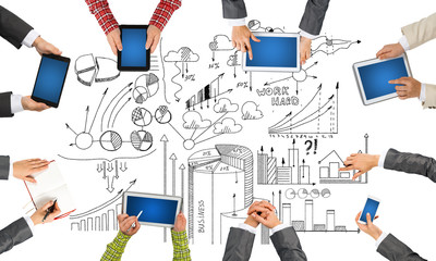 Obraz premium Top view of businesspeople sitting at table and using gadgets