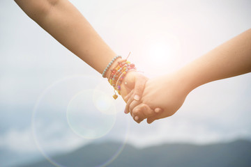Obraz premium couple love holding hand with nature background.
