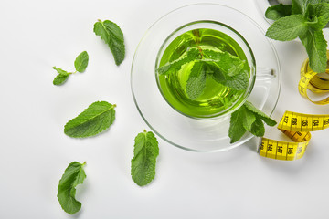 Composition with herbal tea on white background. Weight loss concept