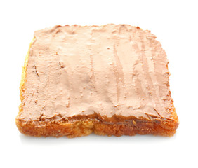 Bread slice with creamy peanut butter on white background