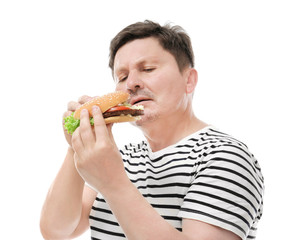 Overweight man with burger on white background. Diet concept