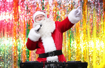 DJ Santa Claus playing music in club
