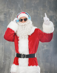 Santa Claus listening to music on grunge background