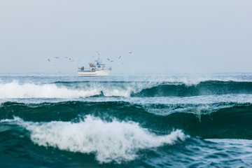 Fishermen boat out on the sea to catch some fish early in the morning. Healthy way of life.