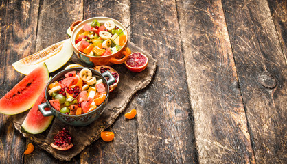 Summer food . Salad of tropical fruits.