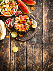 Summer food . Salad of tropical fruits.