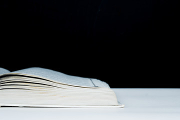 part of opened book with blackboard background, back to school concept