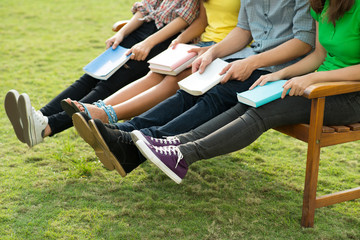 Students resting on bench