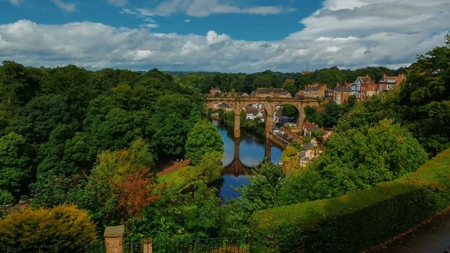 Ultra wide establishing shot of the medieval town of Knaresborough, Yorkshire, England, UK showing the railway viaduct and river Nidd