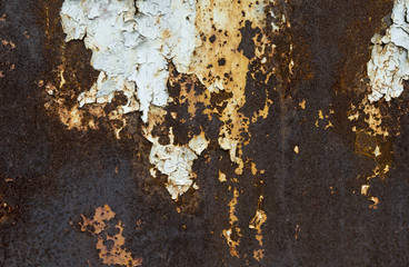 Rusty metal background with streaks of rust.