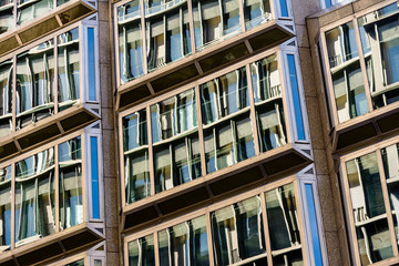 Fototapeta premium Windows on a Multi-Storey Building Showing Reflections