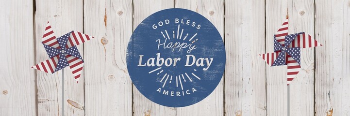 Happy labor day text and USA wind catchers in front of wood