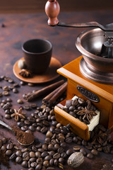 still life of coffee beans with coffee grinder