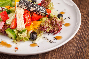 vegetables salad in bowl on wooden table