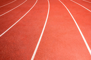Fototapeta premium red running track on athletic stadium