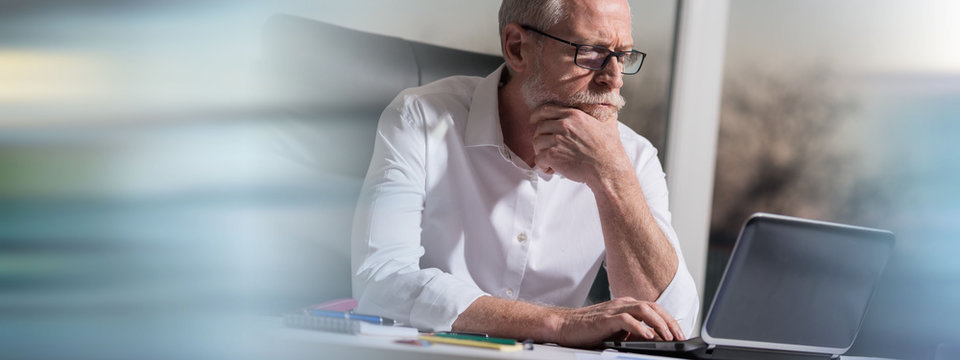 Portrait Of Thoughtful Senior Businessman