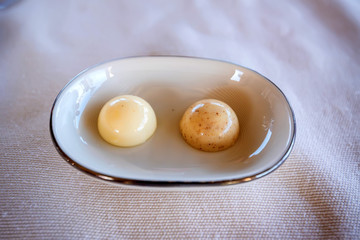 Two round pieces of butter