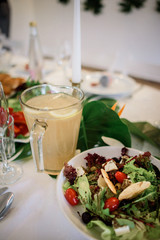 Caesar salad and cup with lemon