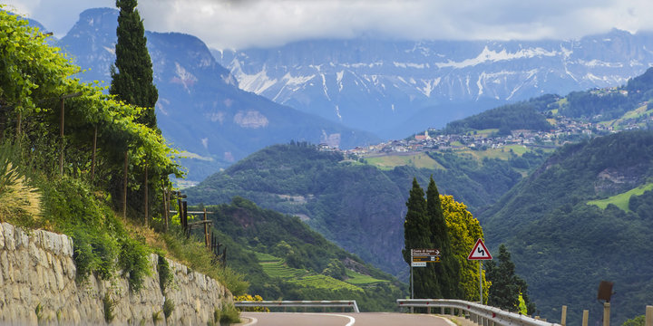 Background landscape view of Grape fields and alpine village in the distance among the mountains in Tyrol, Austria