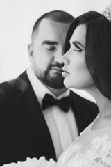 A portrait of loving bride and groom