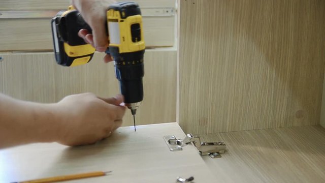 the process of furniture assembly screws closeup