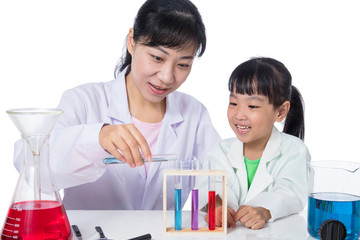 Asian Chinese teacher and little student girl working with test tube