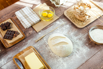 fresh dough on kitchen  rustic wooden table.