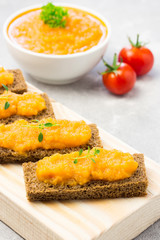 Vegetable marrow spread on toasted bread. Selective focus, copy space.