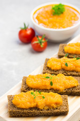 Vegetable marrow spread on toasted bread. Selective focus, close up.