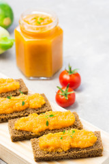 Zucchini caviar in a jar and toasted bread, appetizer. Selective focus.