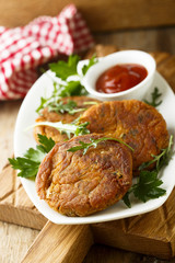 Vegetarian burgers with arugula and tomato sauce