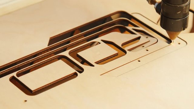 Laser machine cutting wood and plywood