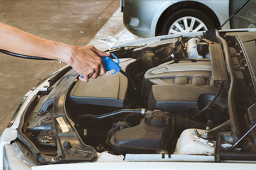Hand Cleaning Car Engine.