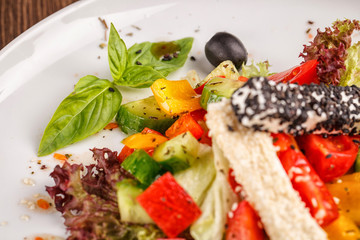 vegetables salad in bowl on wooden table