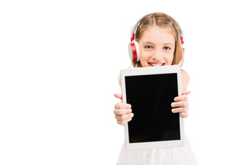 Fototapeta premium child in headphones with tablet