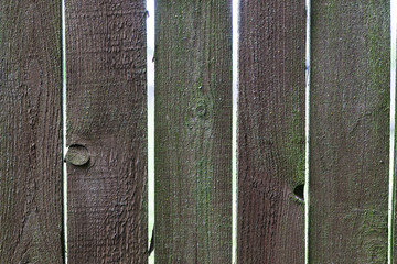 Fragment of an old wooden fence, abstract texture