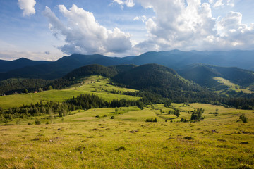 Panorama of summer sunny mountains rural landscape